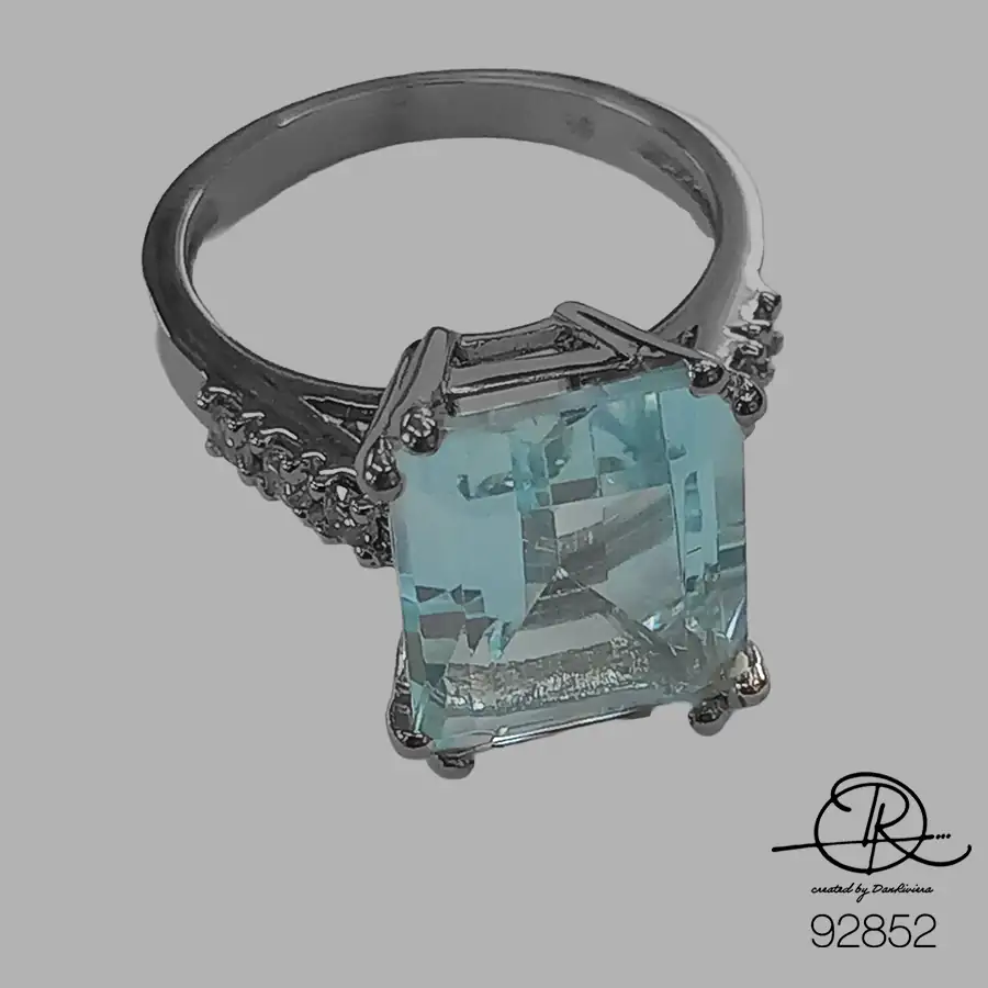 Λευκόχρυσο δαχτυλίδι με aqua marine emerald cut και 6 διαμάντια μπριγιάν